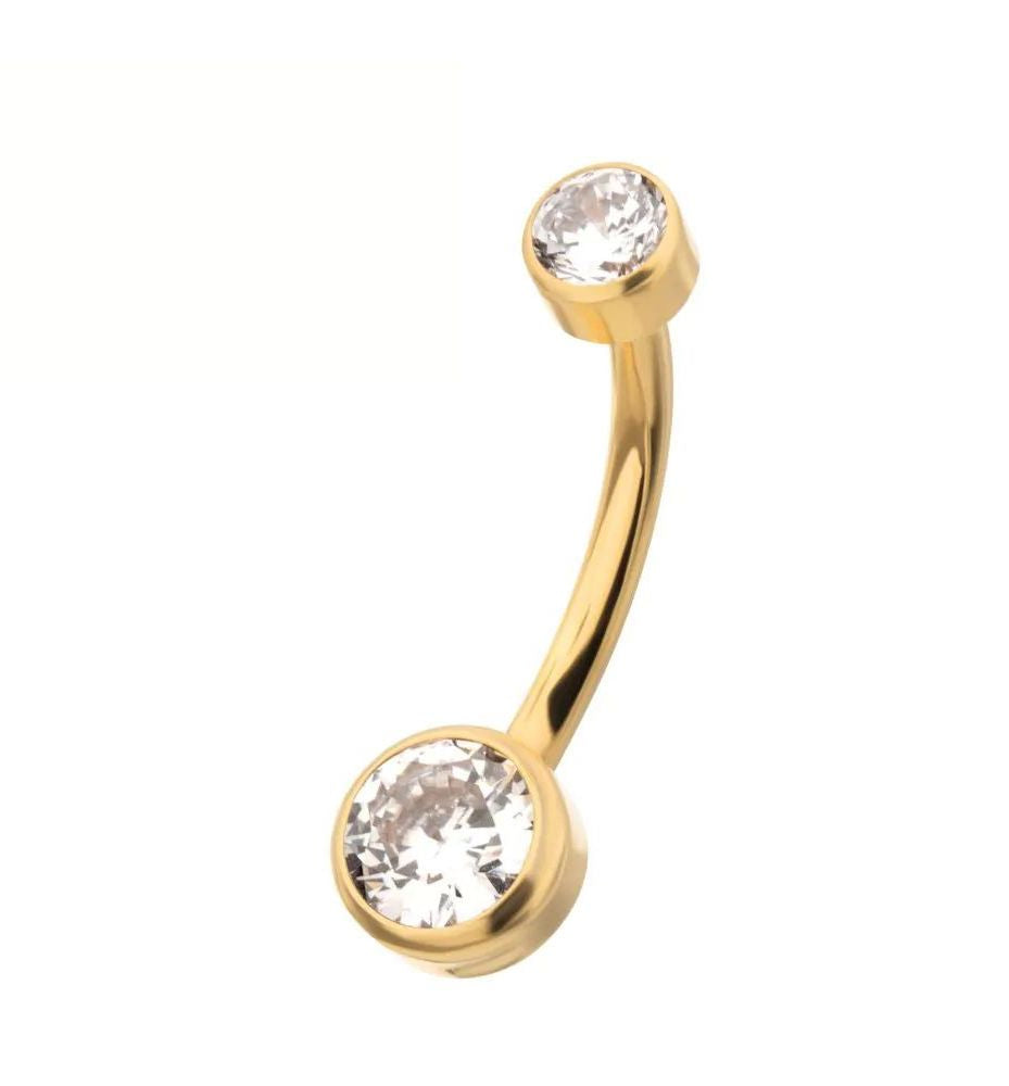 A 24k yellow gold curved navel barbell with two bezel-set swarovski crystals.