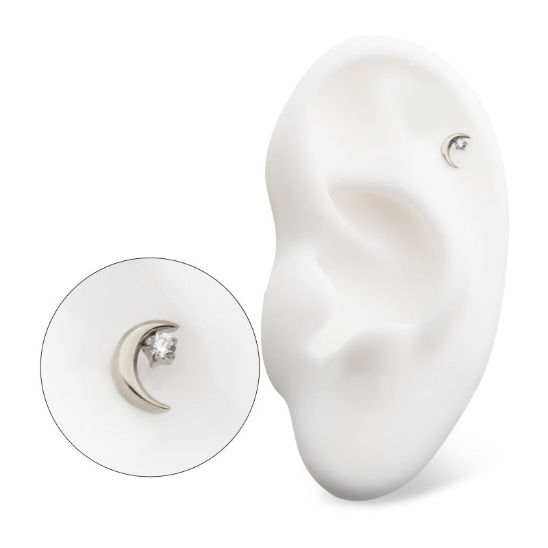 14k white gold moon earring with attached Swarovski "star" - pictured in the helix piercing of a model ear.